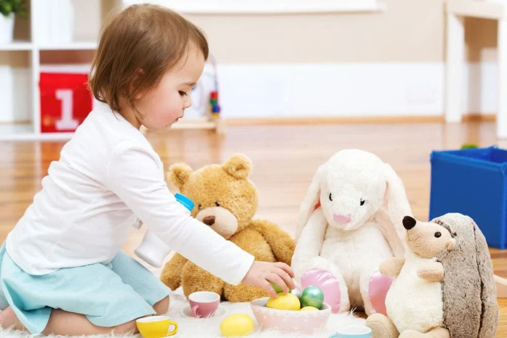 child playing with plushies